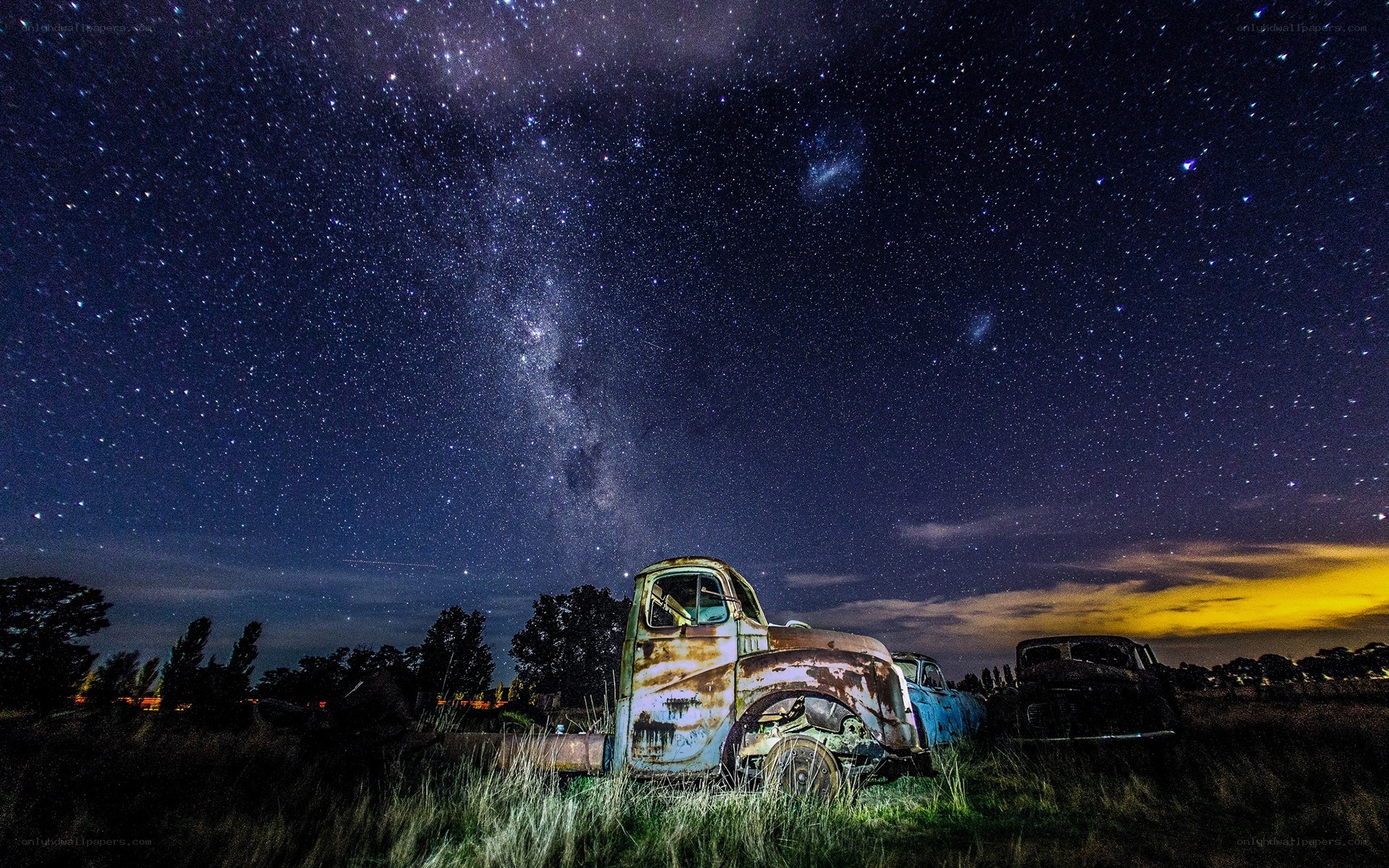 Rusty truck under starry sky