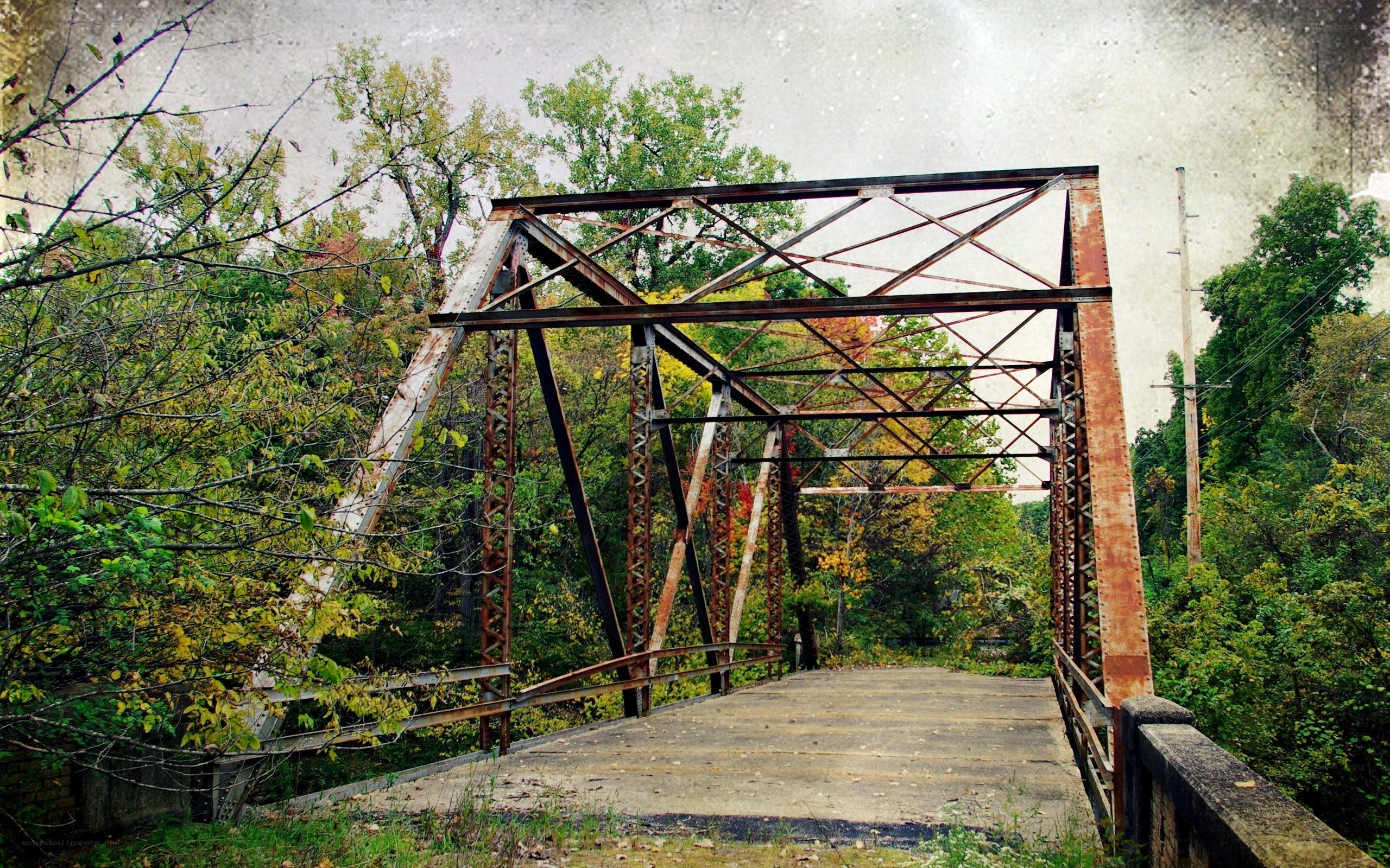 rusty truss bridge in autumn