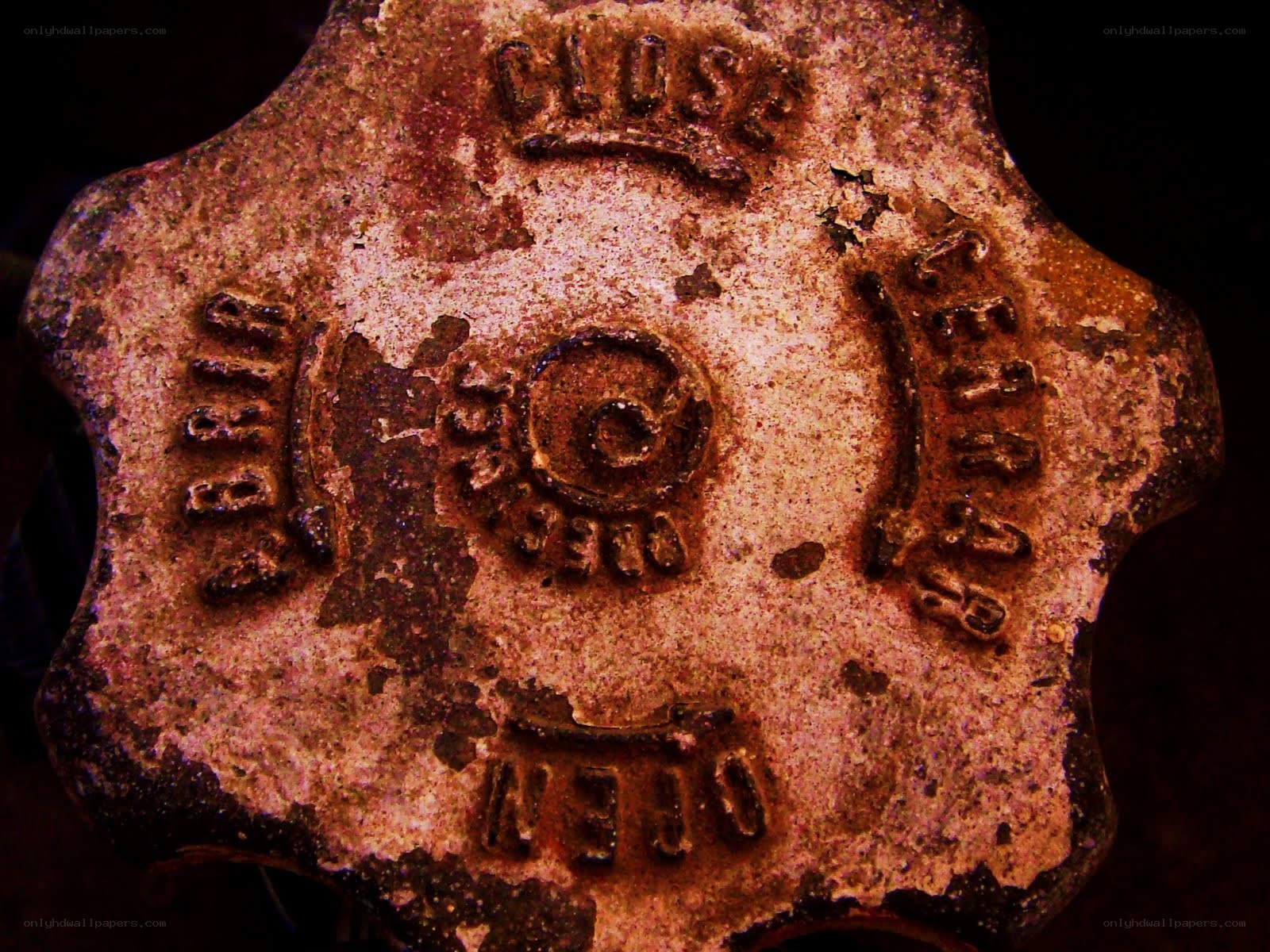 Rusty valve handle with embossed text