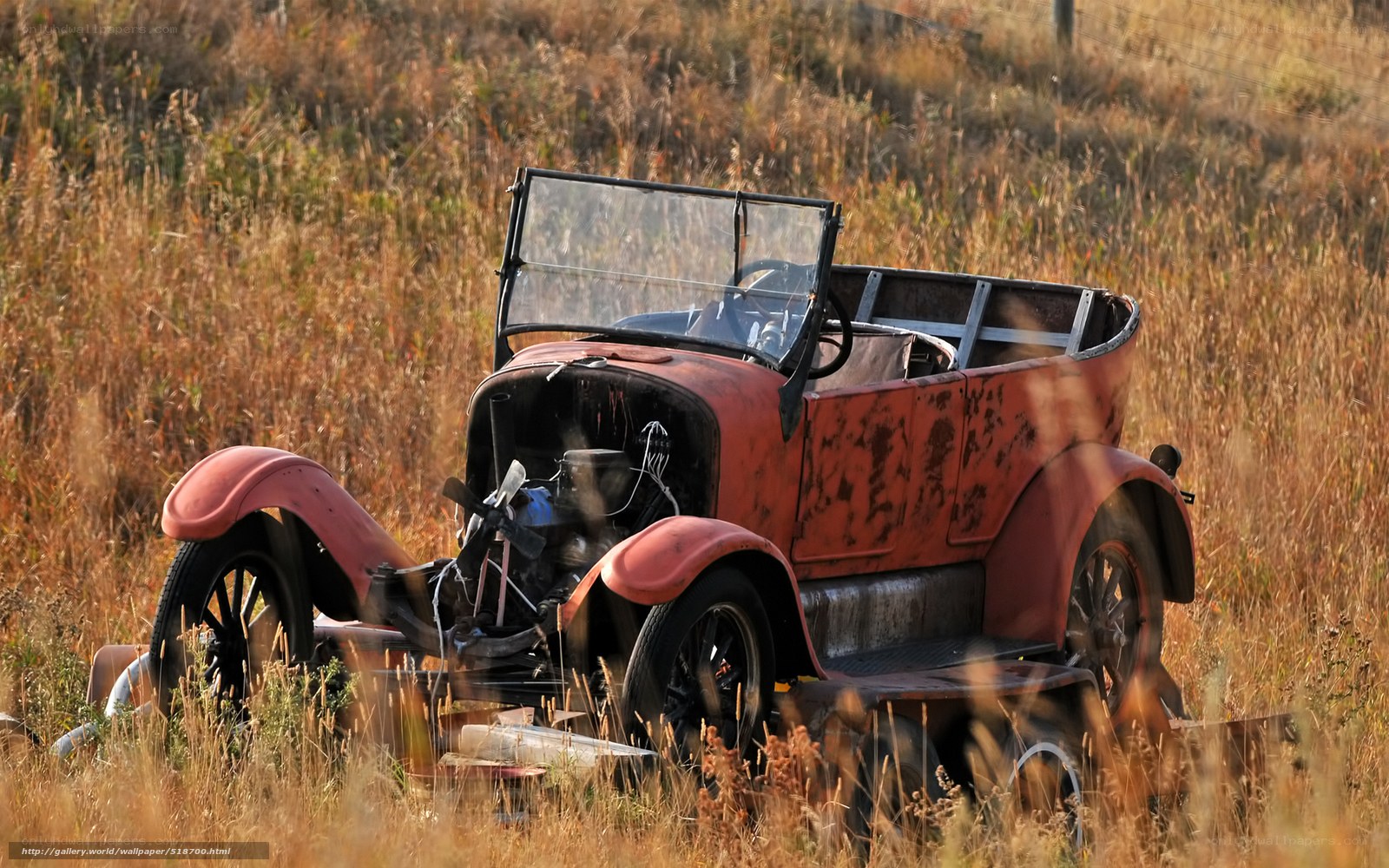 Rusty vintage car in field