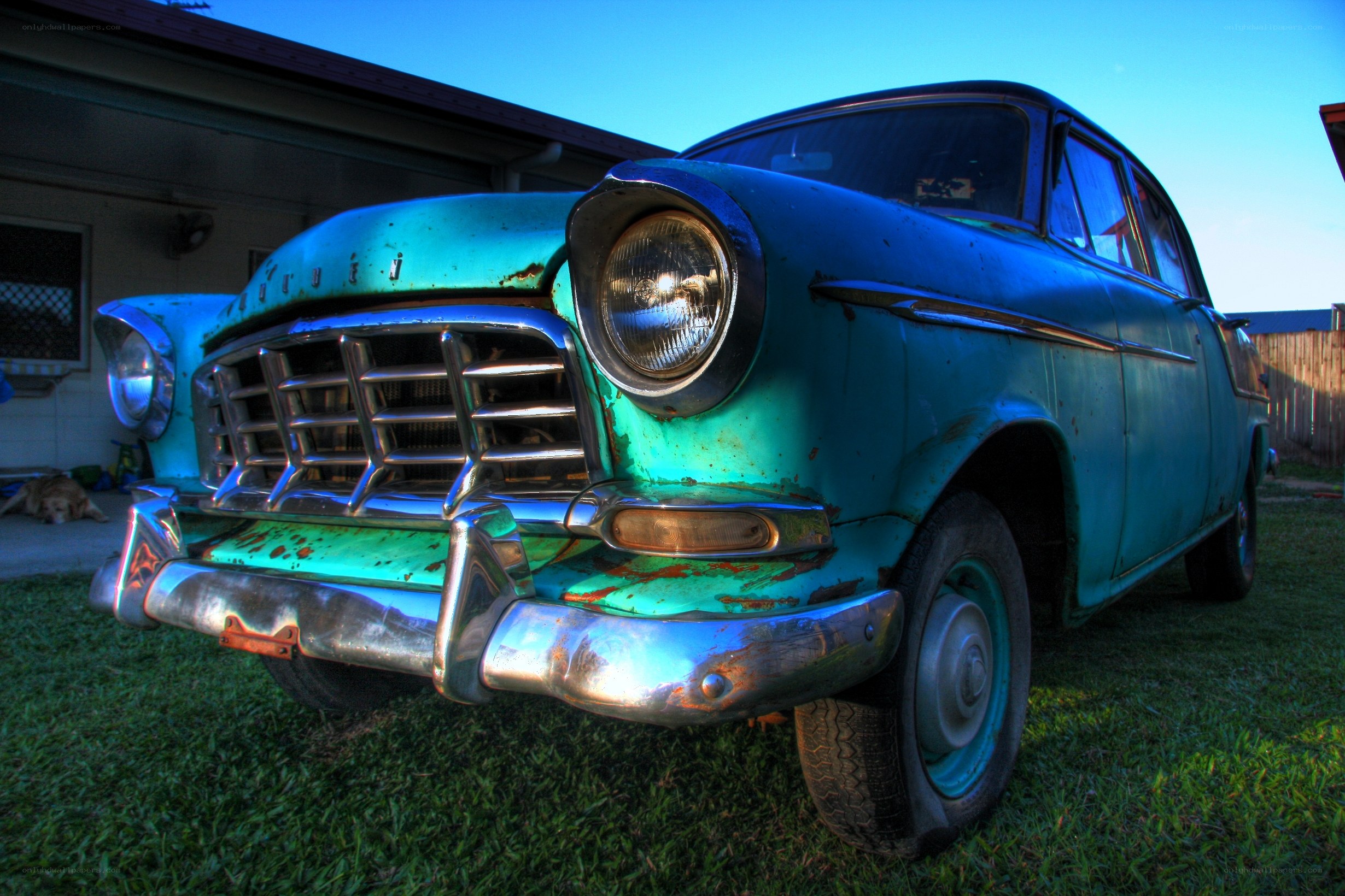 Rusty vintage car on grass