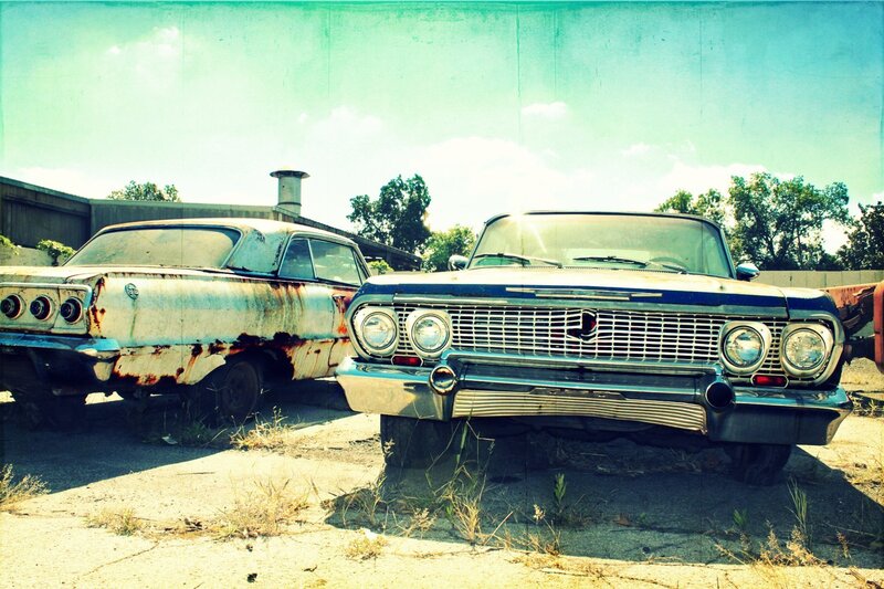 Rusty vintage cars in a junkyard
