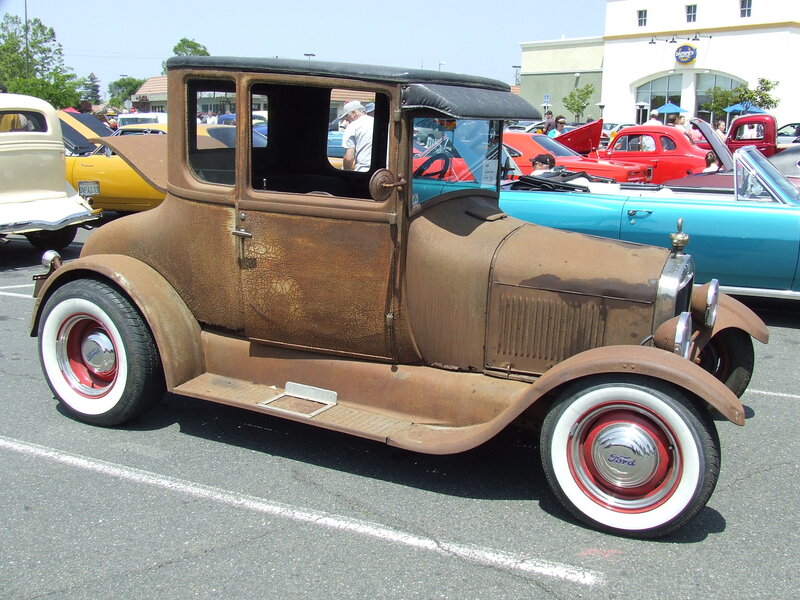 Rusty vintage Ford car