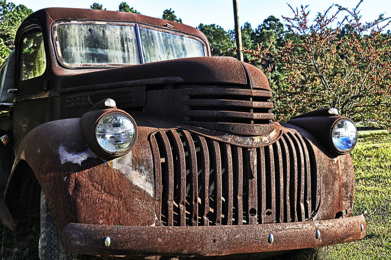 Rusty vintage truck in a field
