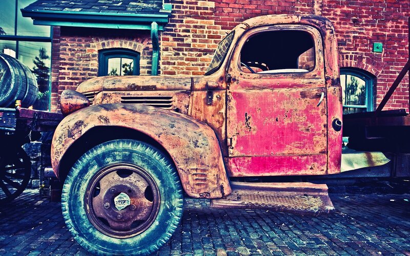 Rusty vintage truck on cobblestones