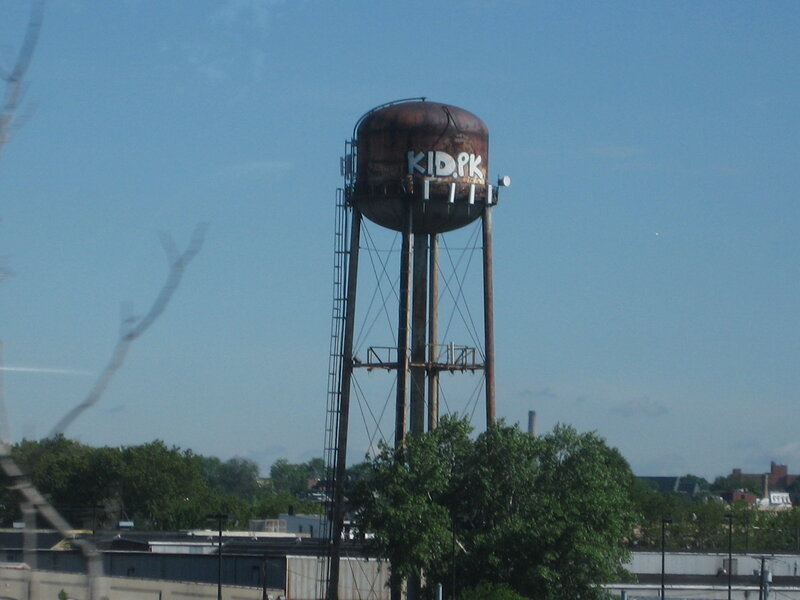 Rusty water tower with graffiti