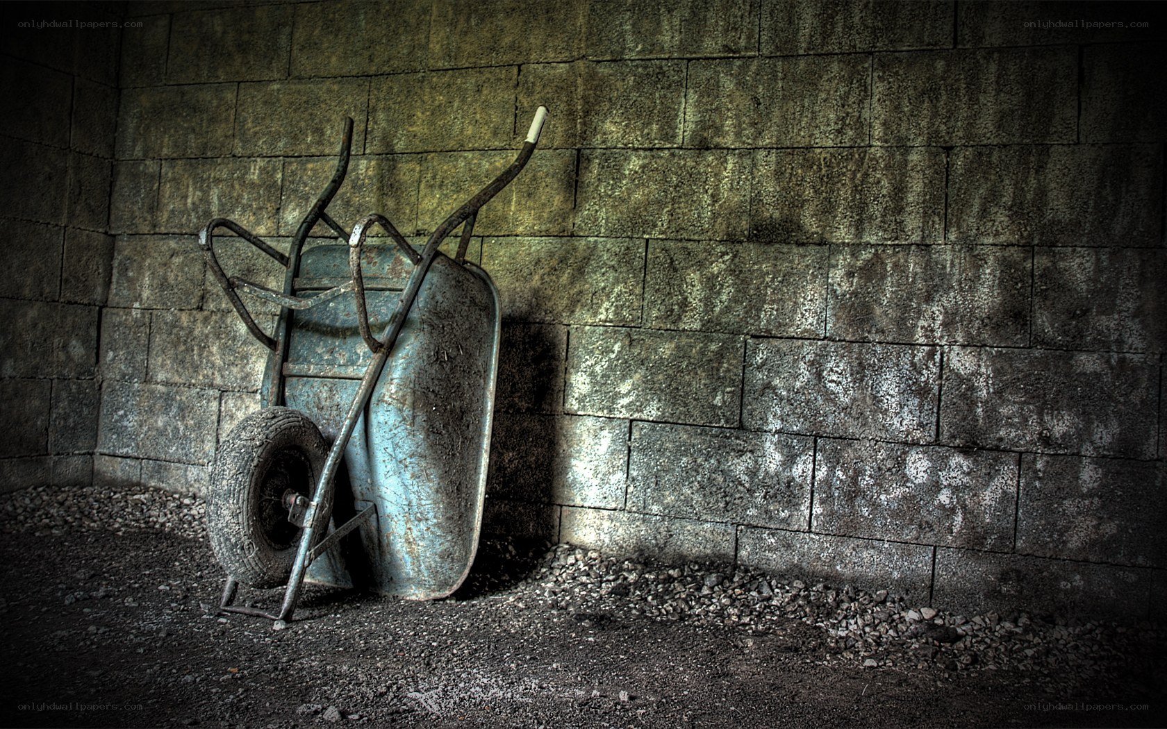 Rusty wheelbarrow in a corner