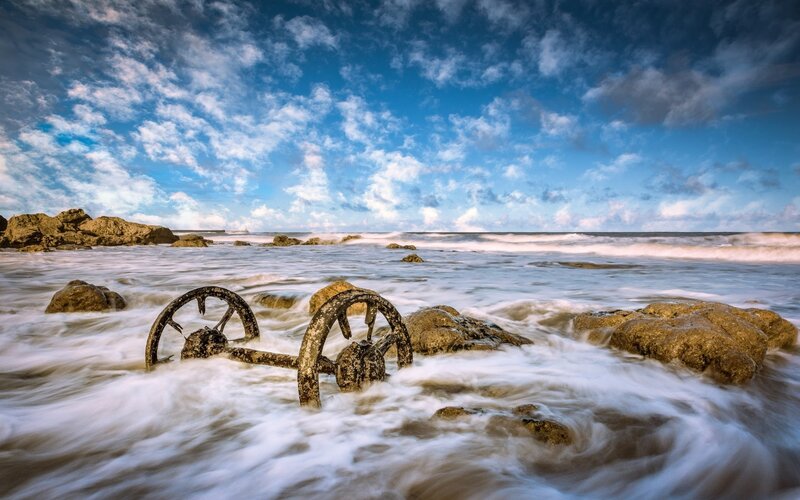 Rusty Wheels on Beach — Blue