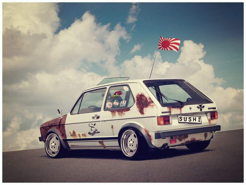 Rusty white car with Japanese flag