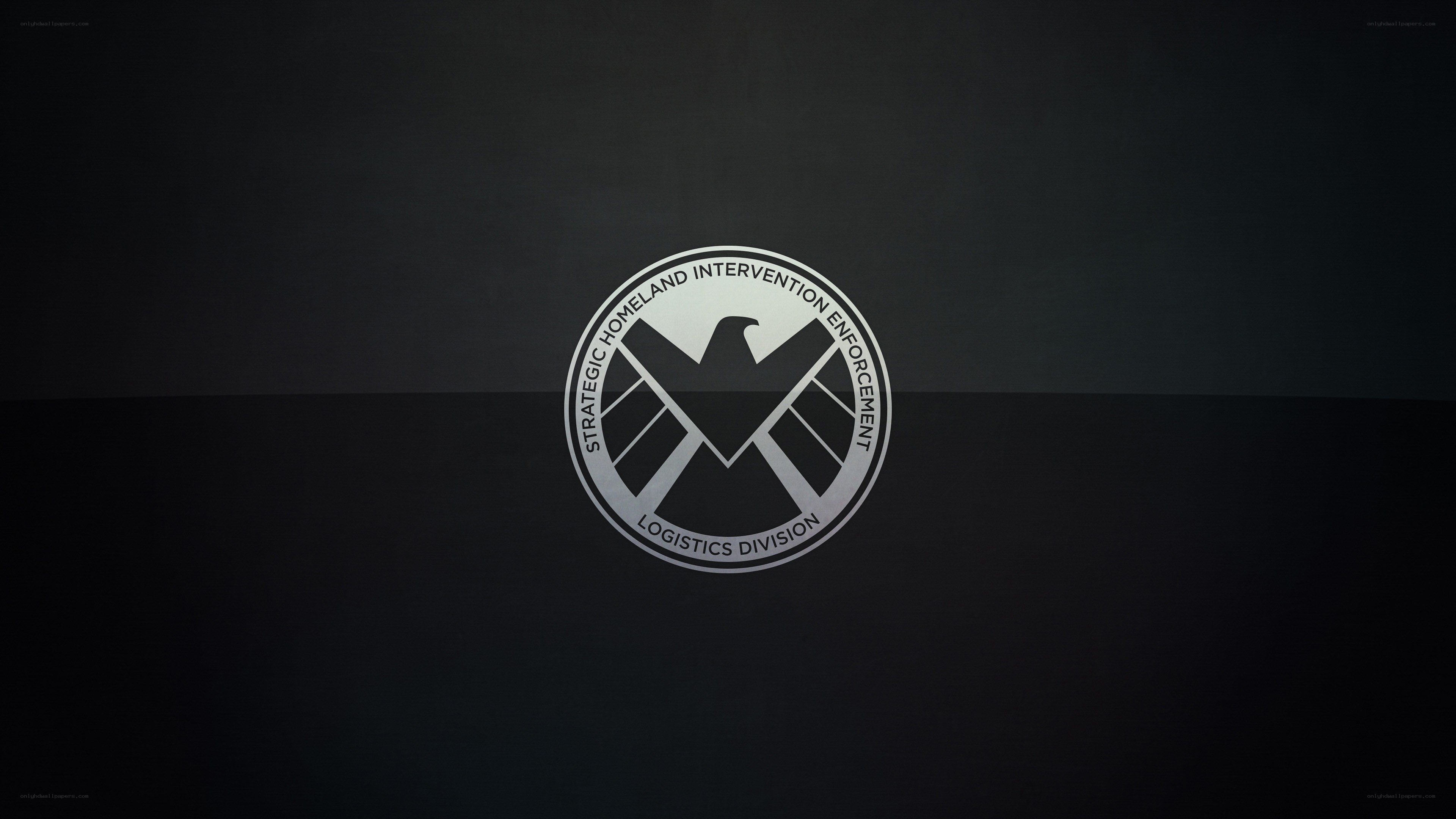 S.H.I.E.L.D. logo on dark background