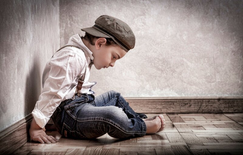 Sad Boy Sitting on Floor