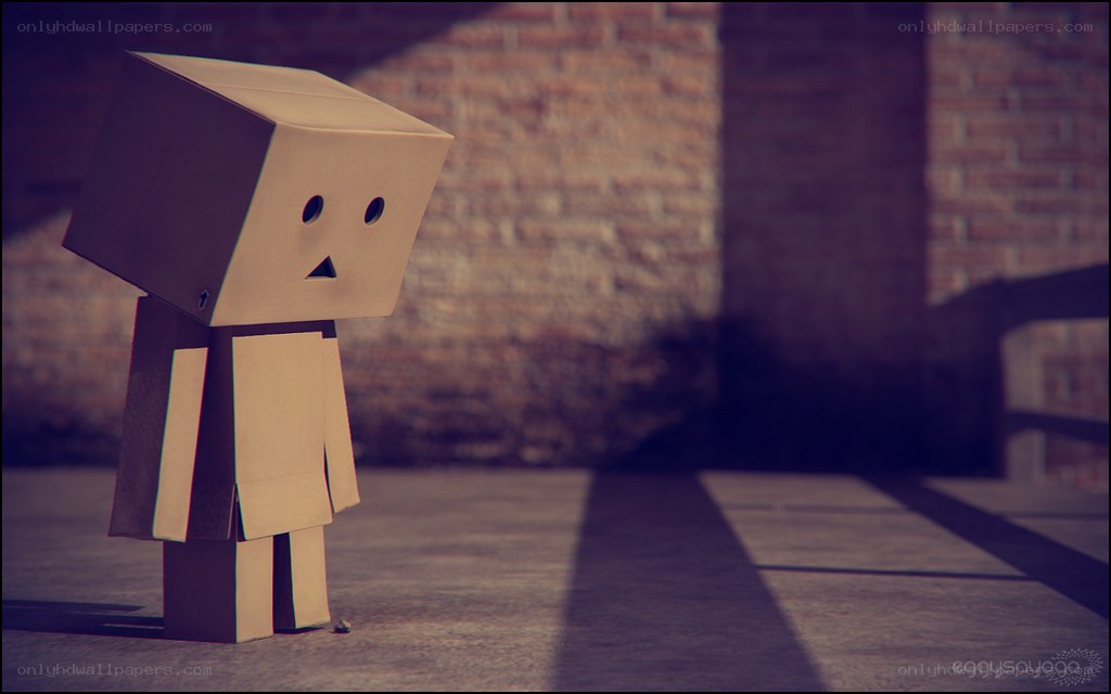 sad cardboard box figure