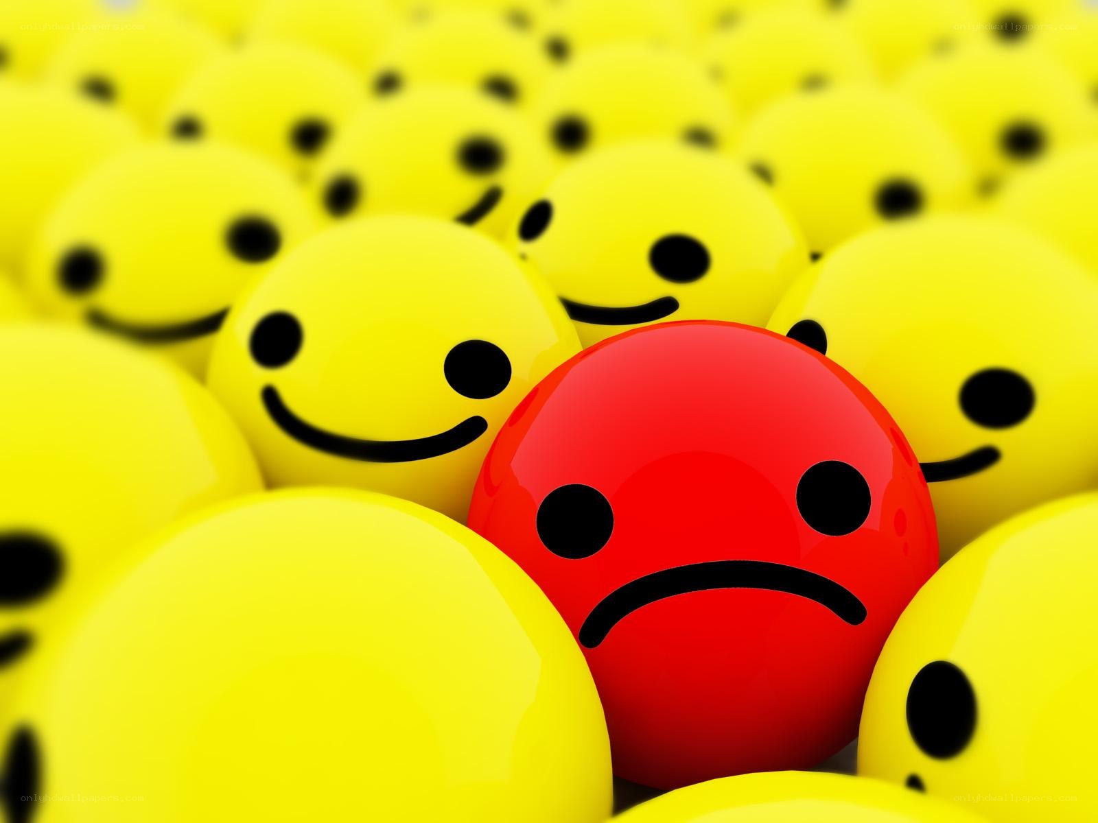 sad face among happy faces