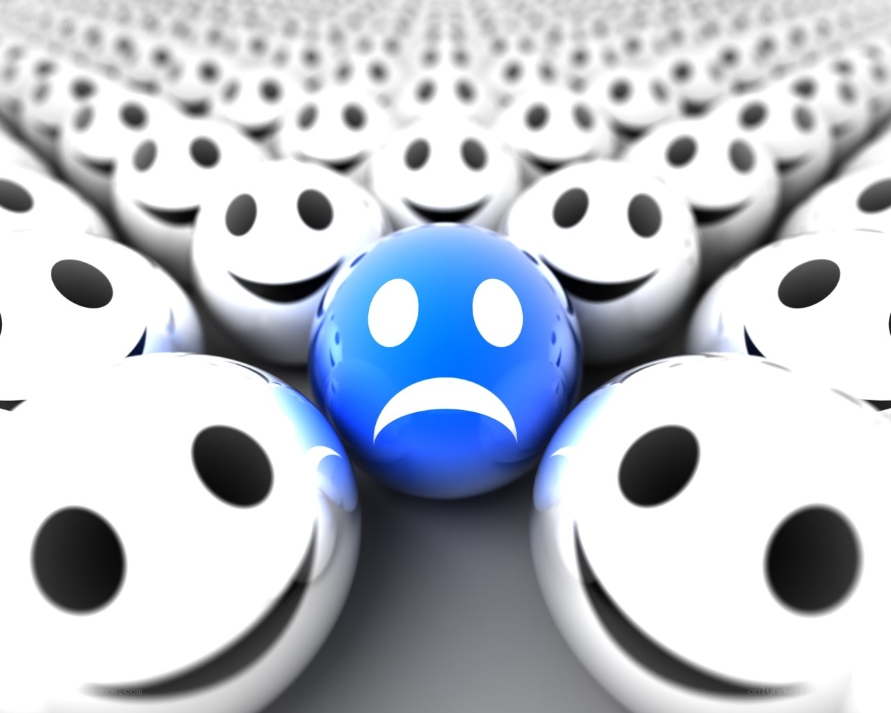 sad face among happy faces