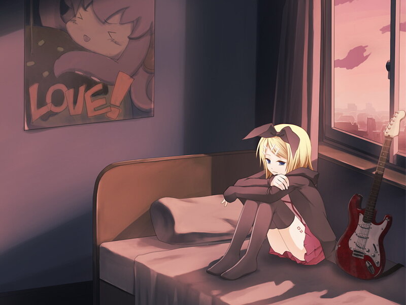 sad girl on bed at sunset