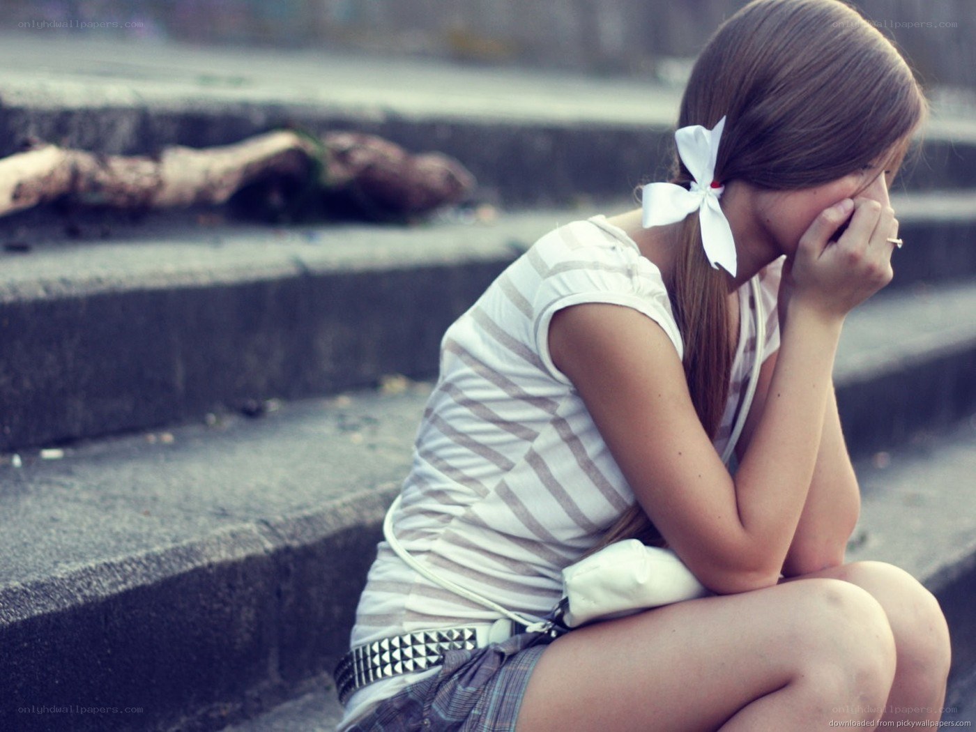 sad girl sitting on steps