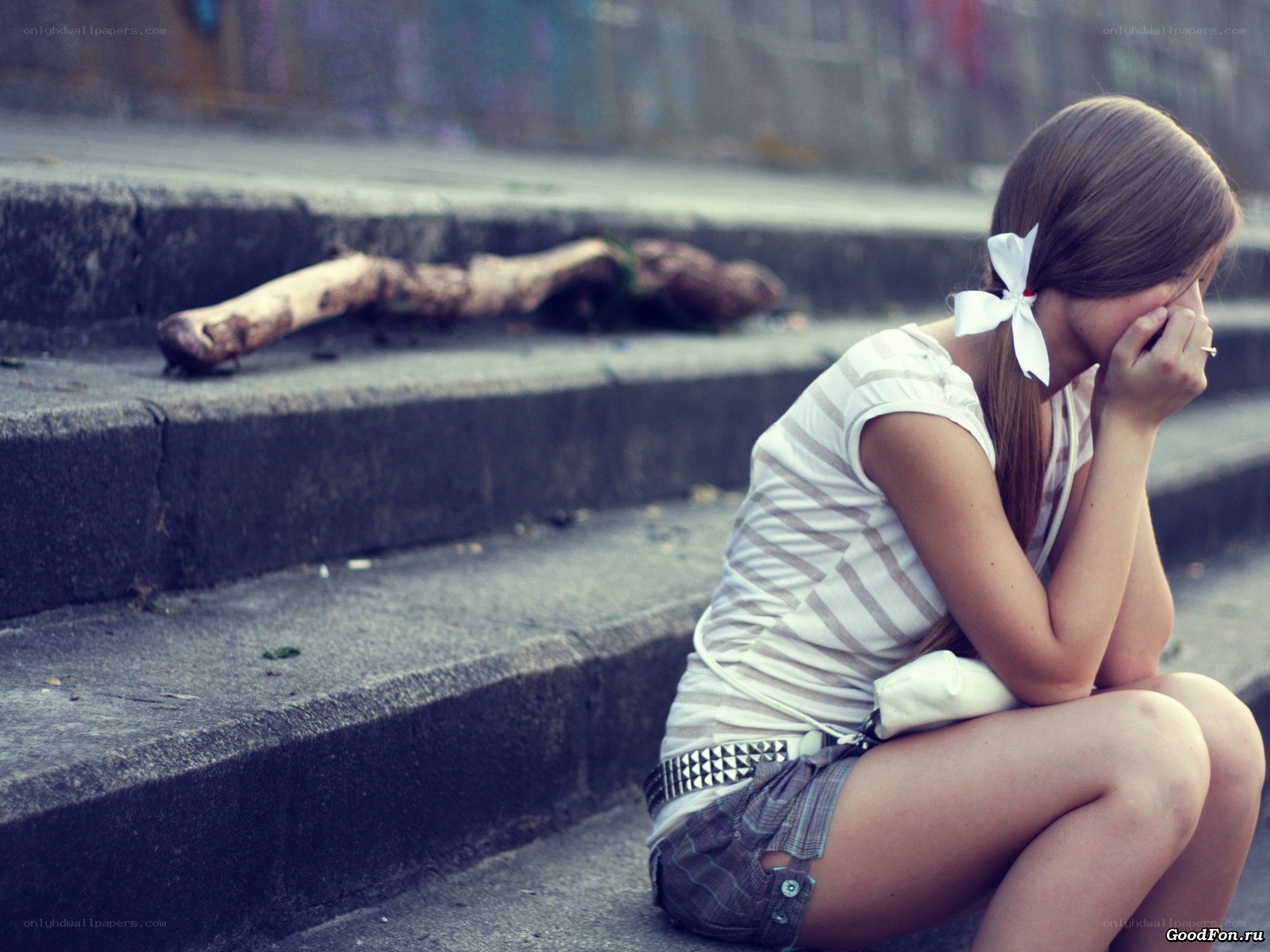 sad girl sitting on steps