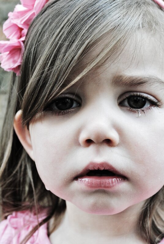 sad little girl with tear