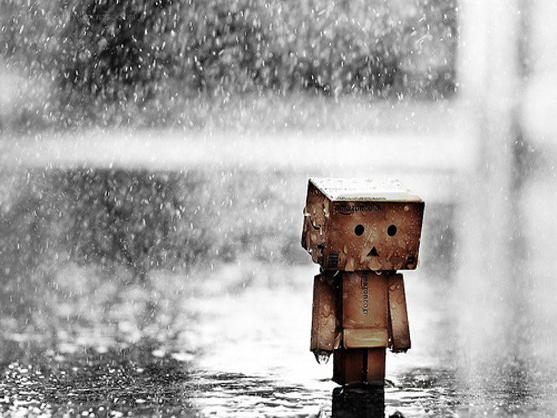 Sad robot in the rain