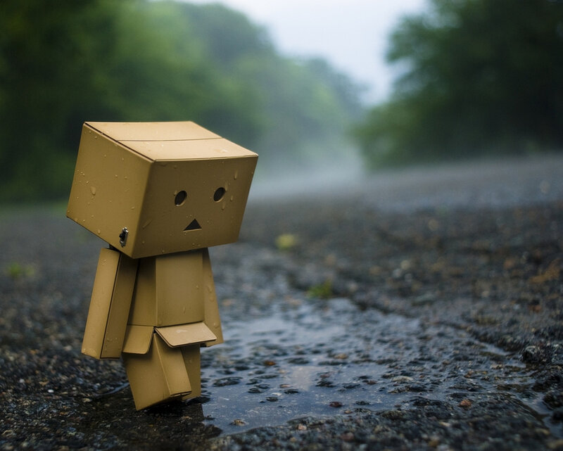 Sad robot in the rain