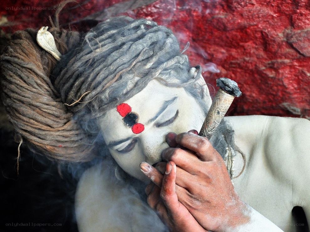Sadhu smoking a pipe