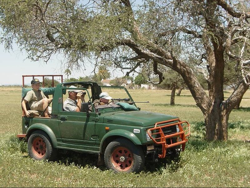 Safari vehicle with hunters
