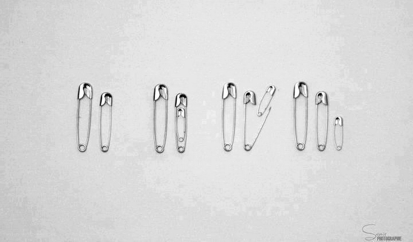 safety pins arranged by size