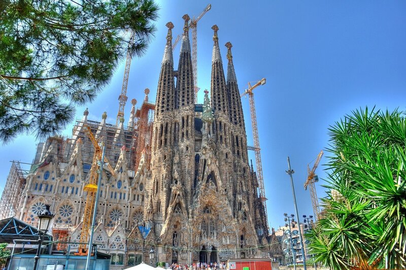 Sagrada Familia Cathedral — Blue, Dramatic, Afternoon, Photograph, Cranes, Trees