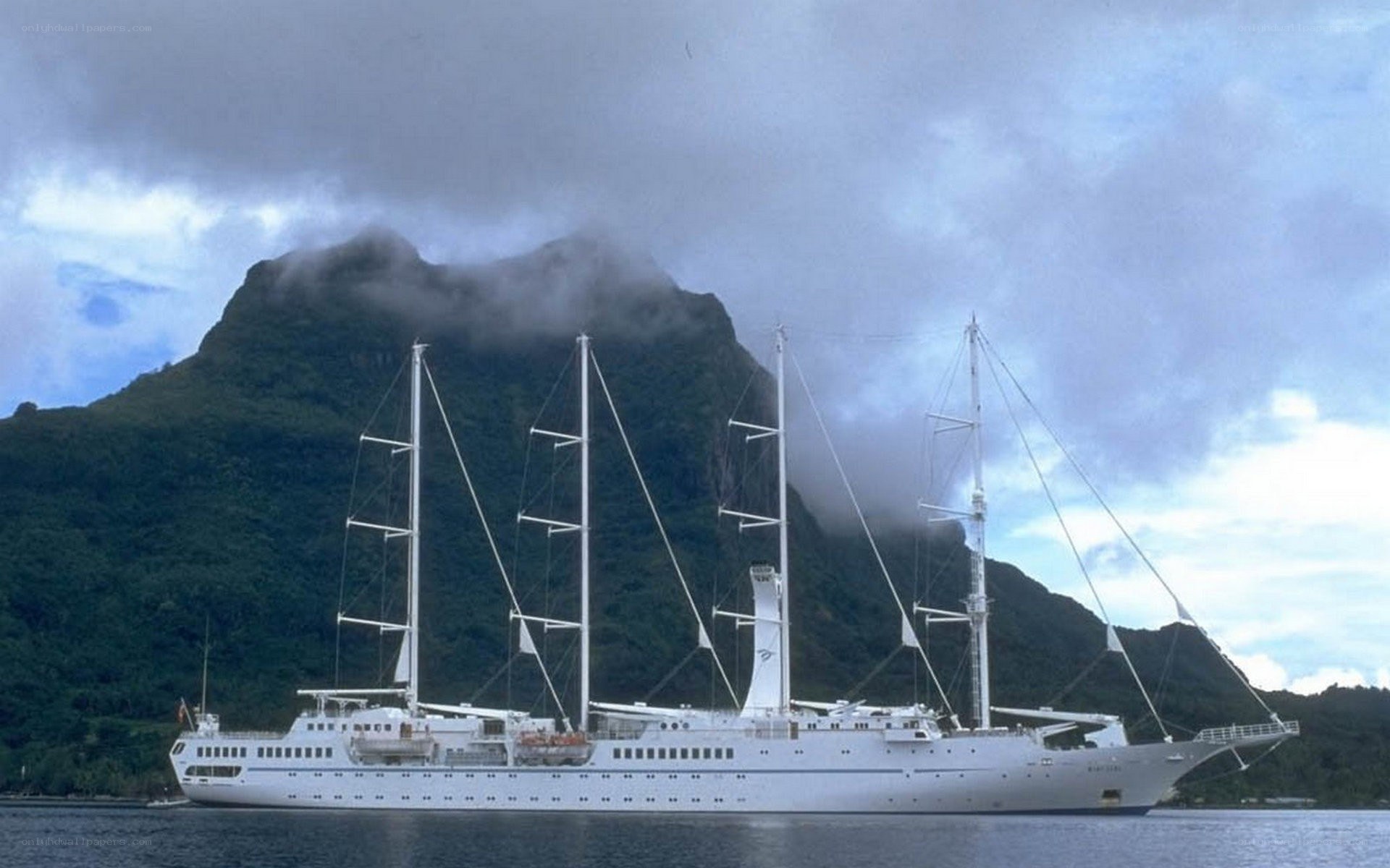 sail ship near mountain