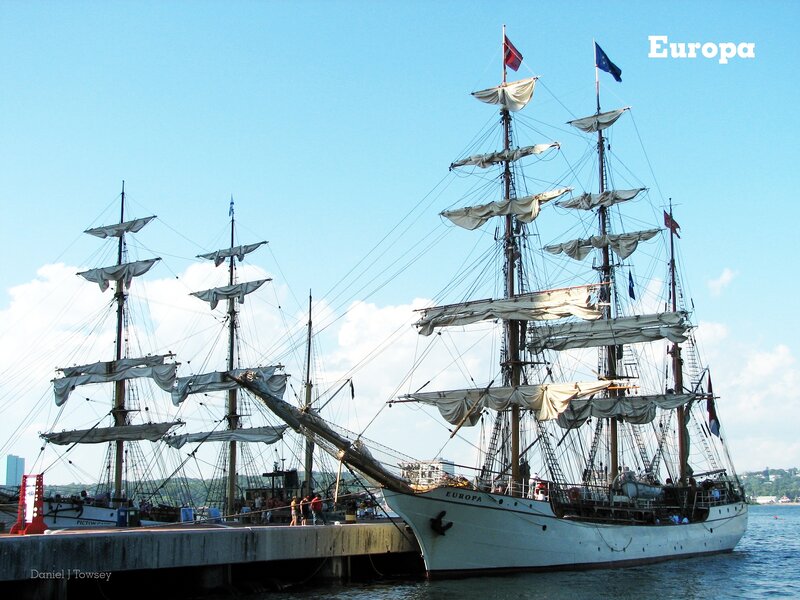 Sail ships at a harbor