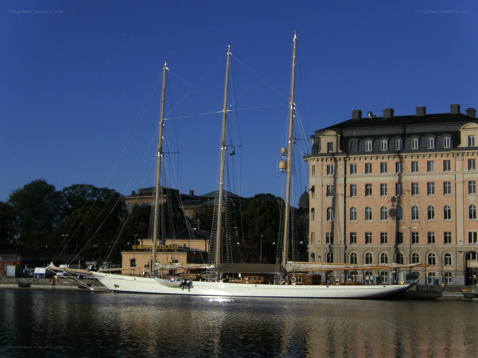 Sailboat at a city harbor