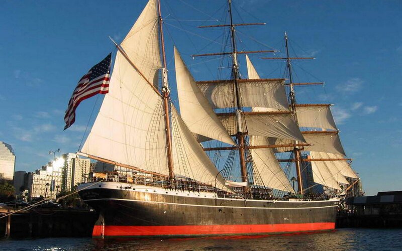 Sailboat at a city harbor