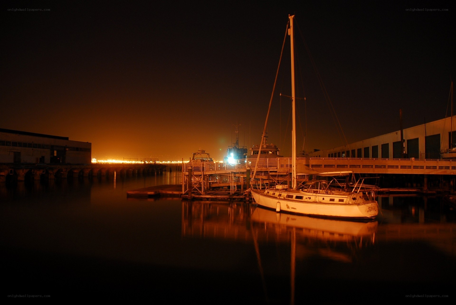 Sailboat at a dock at night