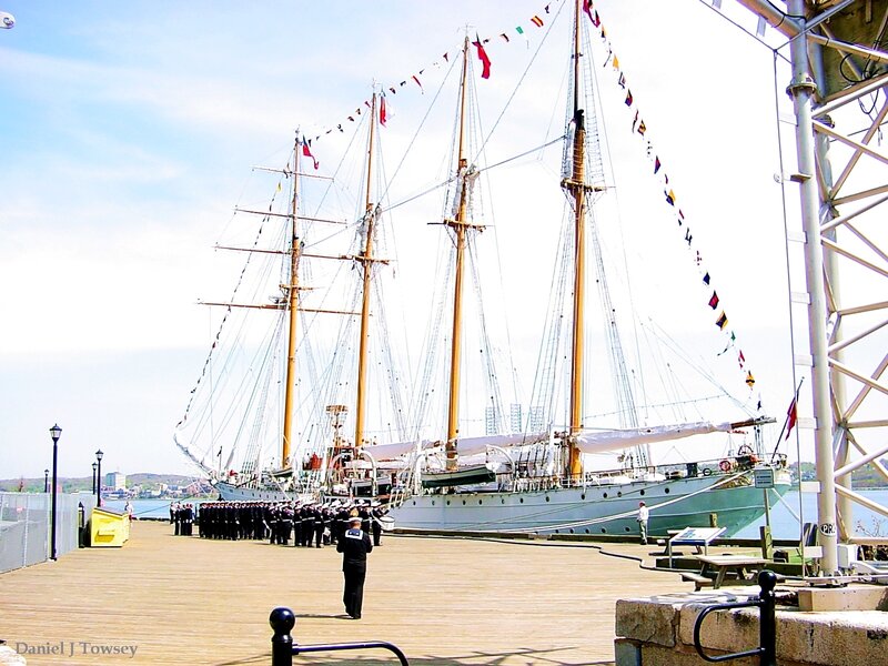 Sailboat at a dock with crew
