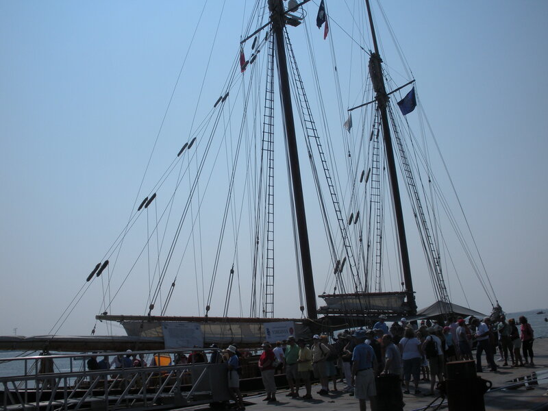 Sailboat at a dock with people
