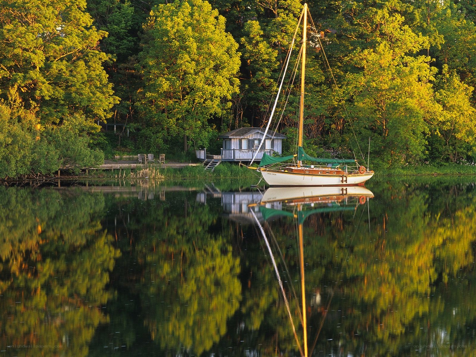 Sailboat at a lakeside cabin