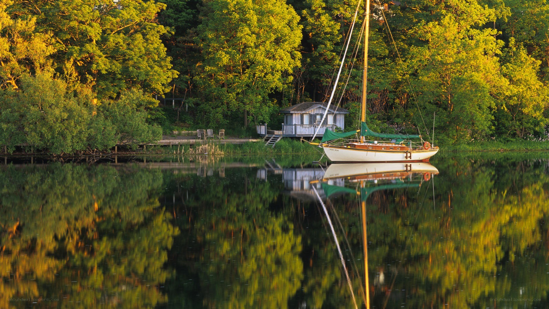 Sailboat at a lakeside cabin