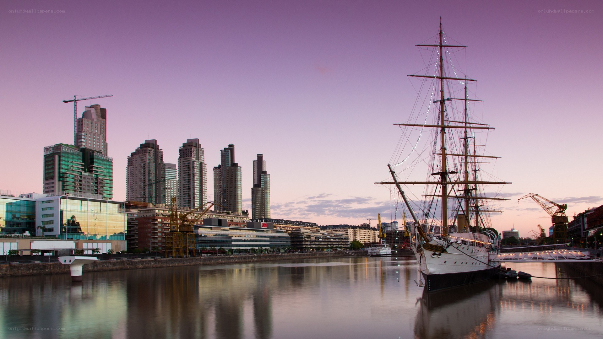 sailboat at dusk in city