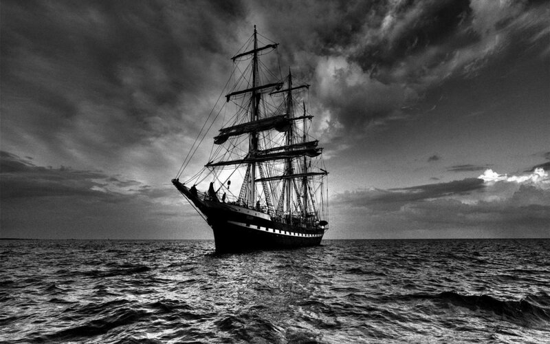 sailboat at sea in black and white