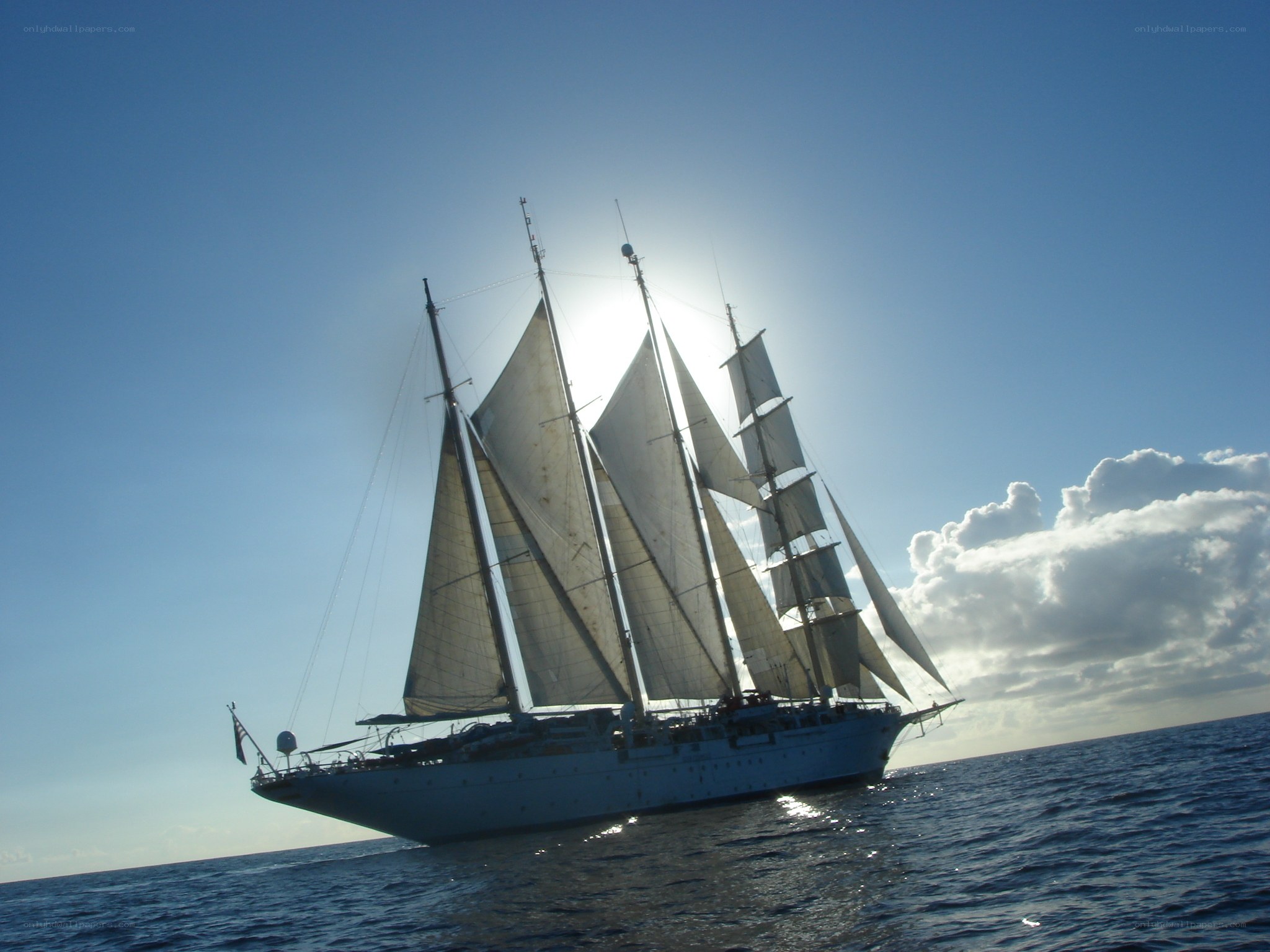 sailboat at sea in sunlight