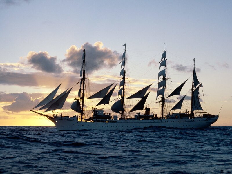 Sailboat at Sunset — Blue, Serene, Photograph, Ocean, Sky, Clouds, Yellow