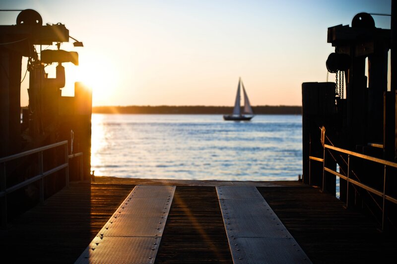 sailboat at sunset from dock