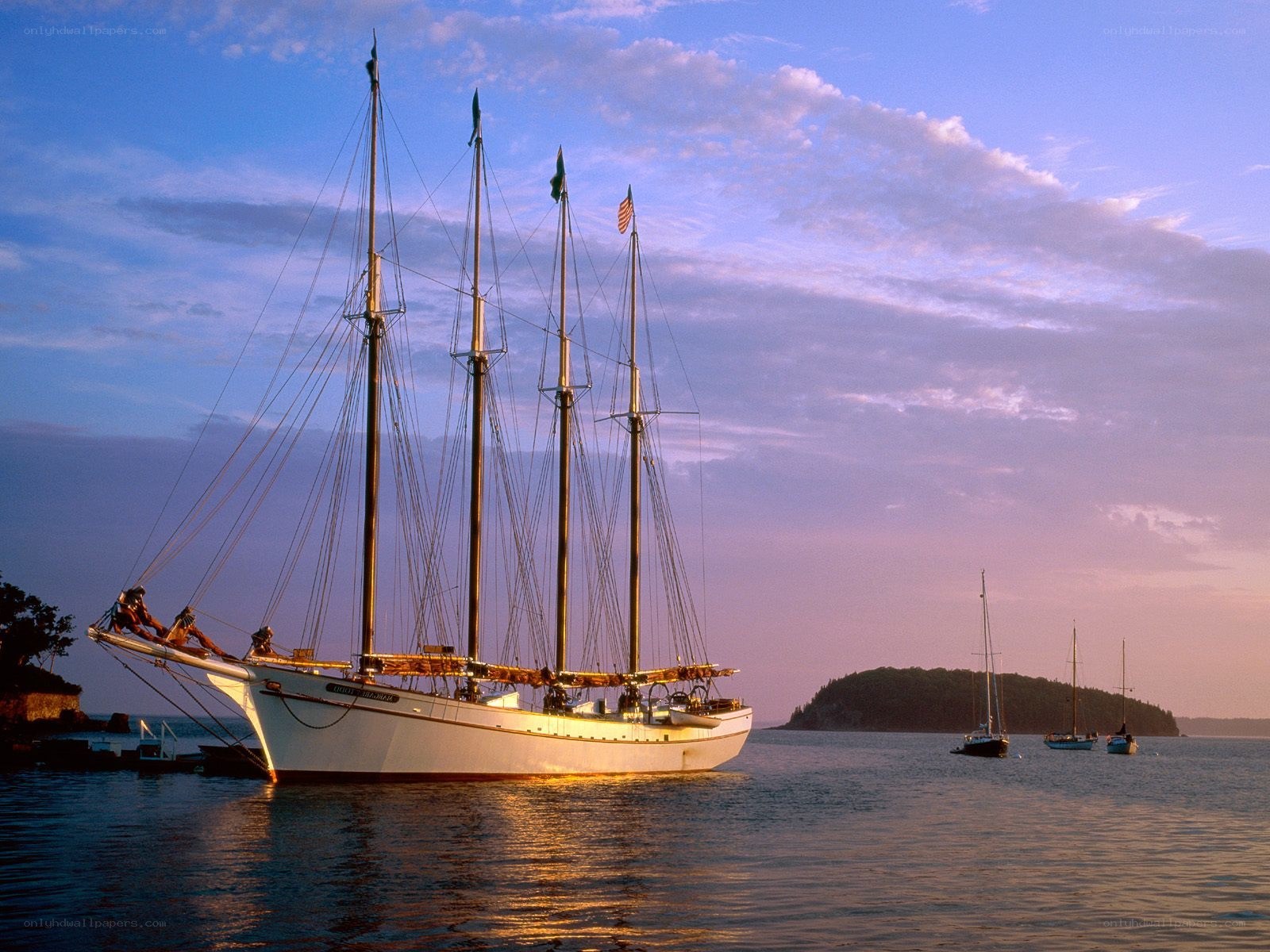 Sailboat at sunset in harbor