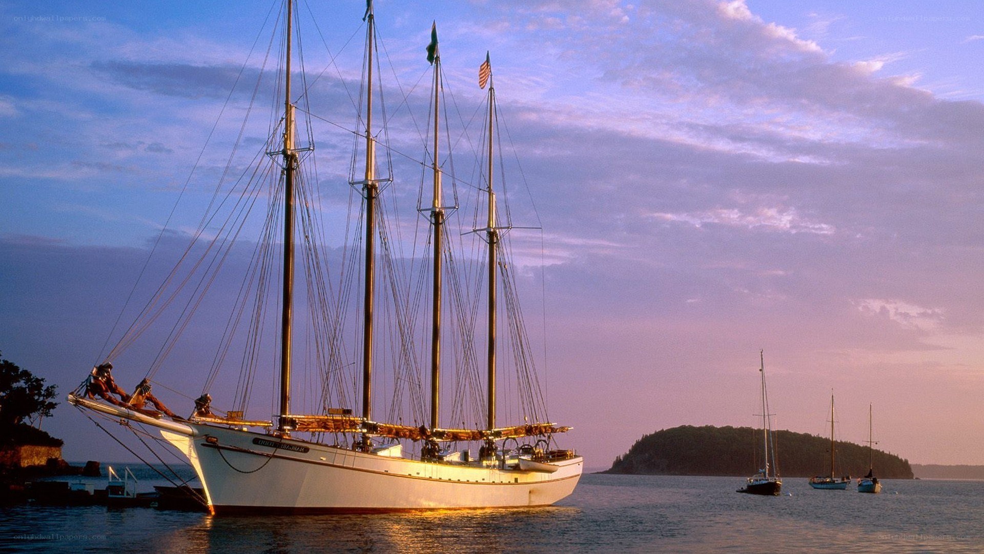 Sailboat at sunset in harbor