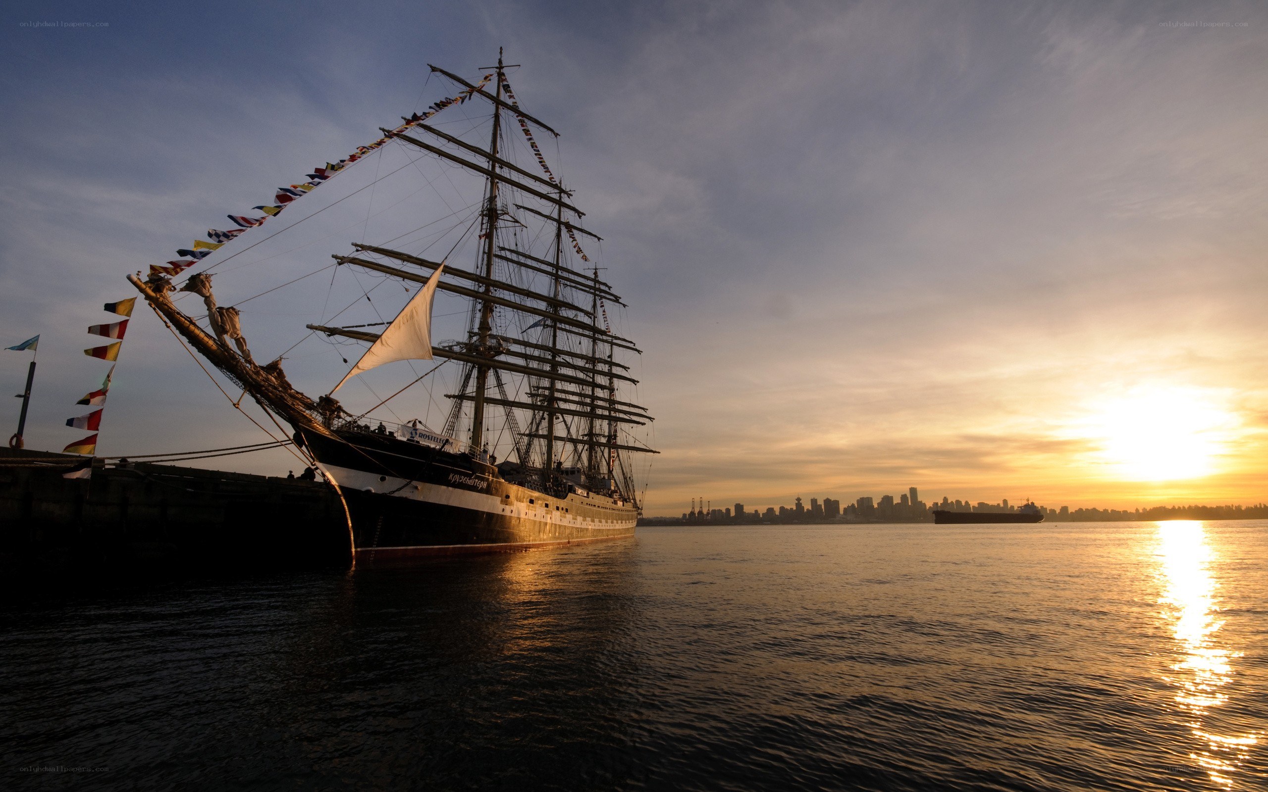 sailboat at sunset in harbor