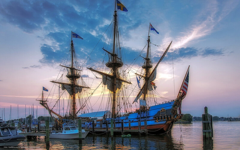Sailboat at sunset in harbor