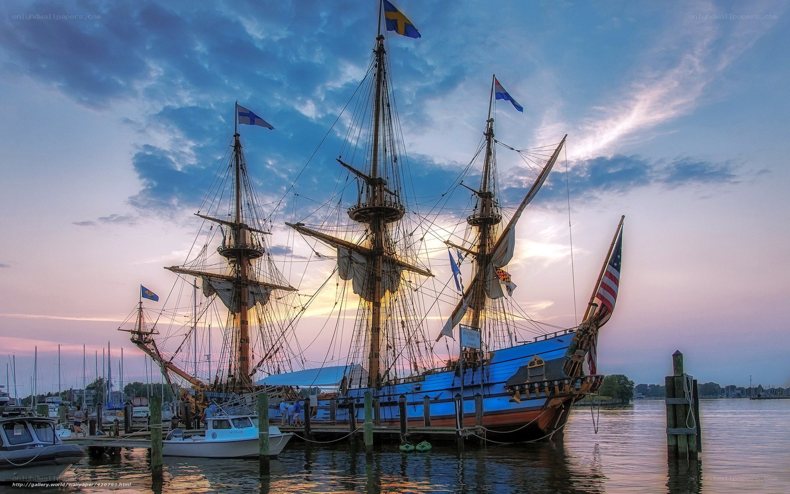 Sailboat at sunset in harbor