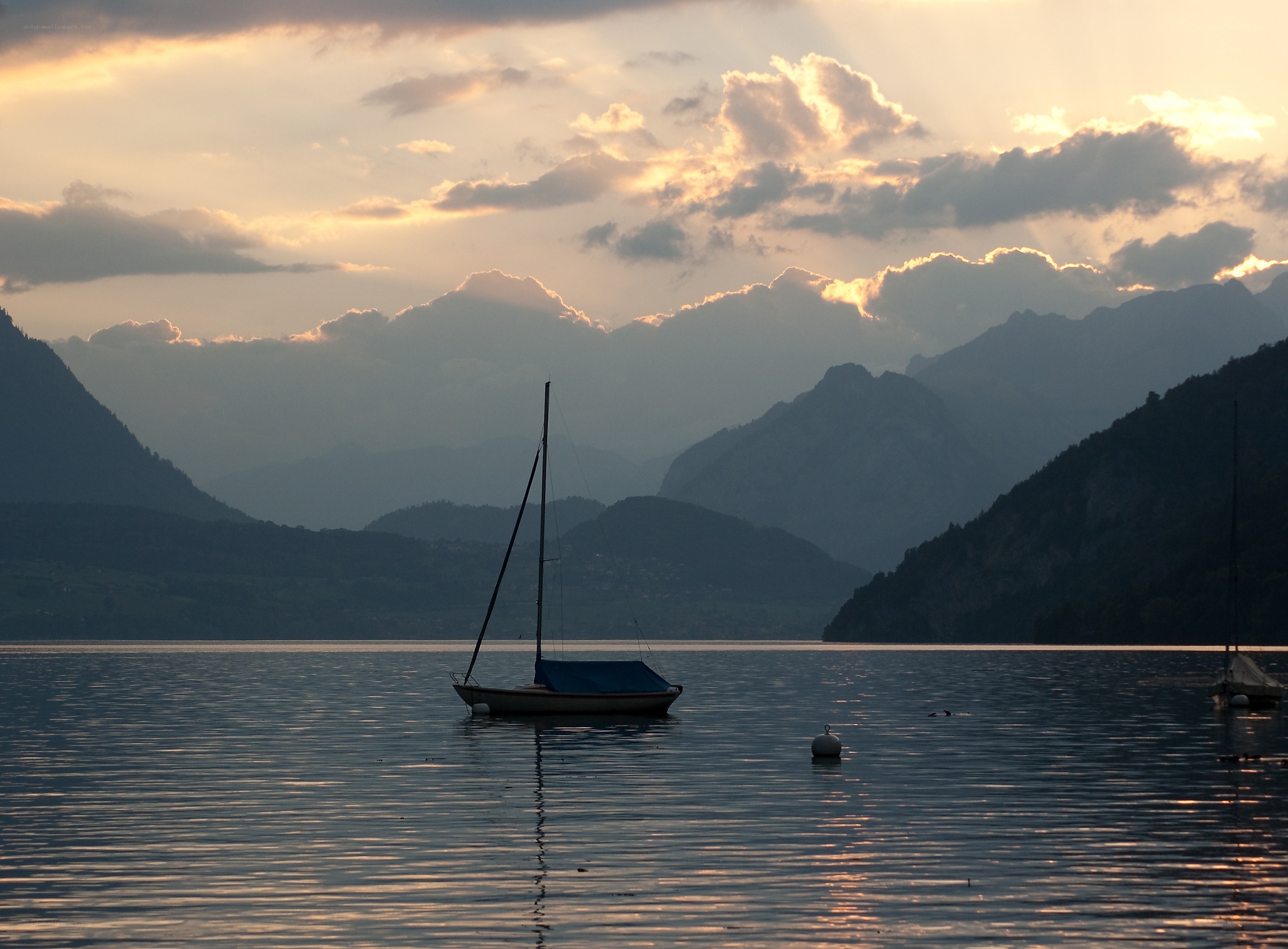 Sailboat at sunset on a lake