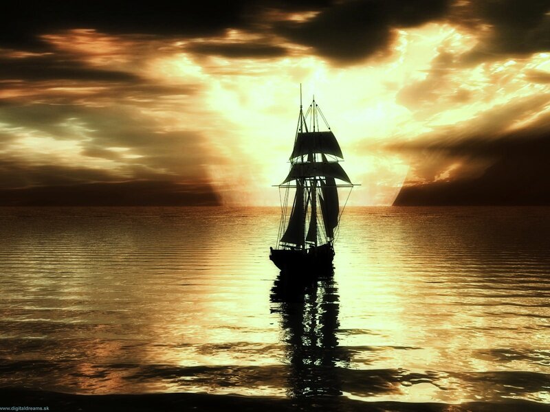 Sailboat at sunset on calm sea