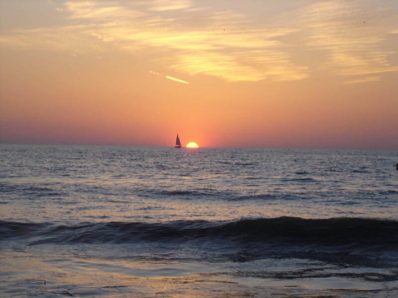 sailboat at sunset on the ocean